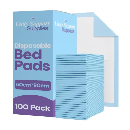 Stack of blue disposable bed pads next to packaging box.