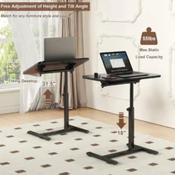 Two height adjustable over bed tables with tilting desktops in a room.