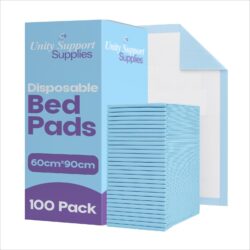 Stack of blue disposable bed pads next to packaging box.