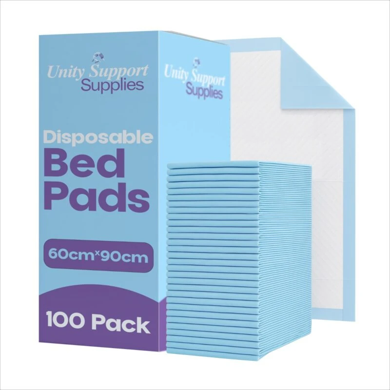 Stack of blue disposable bed pads next to packaging box.