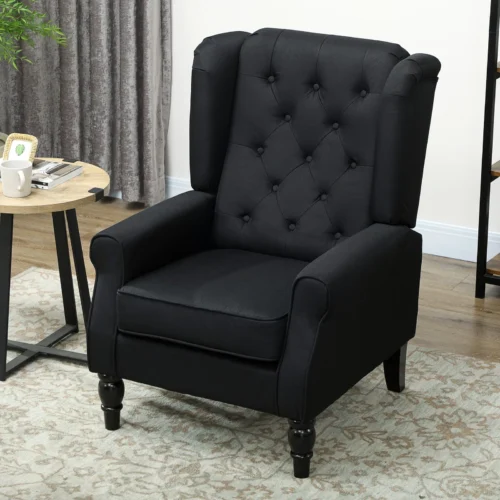Black tufted wingback armchair in a living room setting.