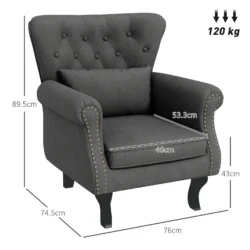 Dark grey tufted wingback armchair with dimensions and weight limit.