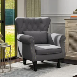 Dark grey Chesterfield-style accent chair with tufted back and pillow.