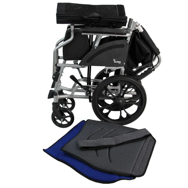 Folded aluminium wheelchair with black wheels and separate cushions.