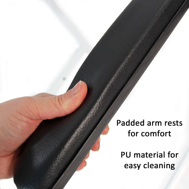 Close-up of a hand pressing a padded armrest with visible text about comfort.