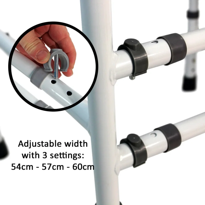 Close-up of toilet frame with adjustable width settings and hand adjusting clamp.