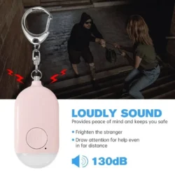 Personal alarm with keychain, text highlighting 130dB sound, and an image of a potential threat scenario.