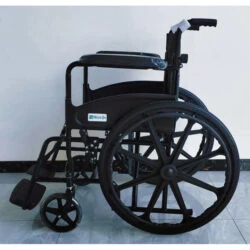 Folded black manual wheelchair with large rear wheels.