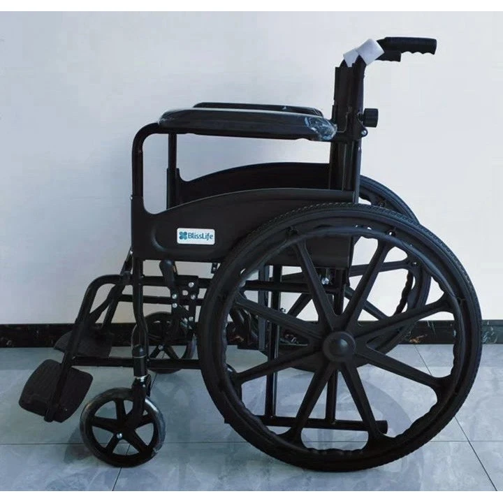 Folded black manual wheelchair with large rear wheels.