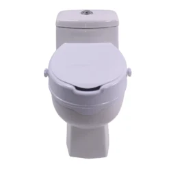 Raised toilet seat aid with lid installed on a toilet.