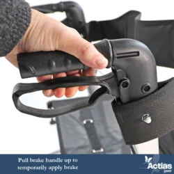 Close-up of a hand pulling a rollator brake handle.