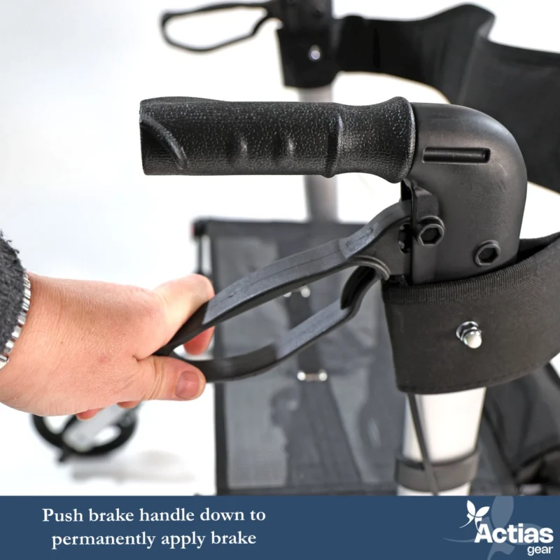 Close-up of a hand operating the brake handle on a rollator.