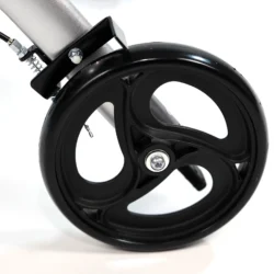 Close-up view of a black wheel on a rollator walker.