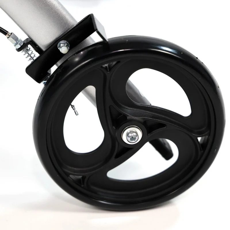 Close-up view of a black wheel on a rollator walker.