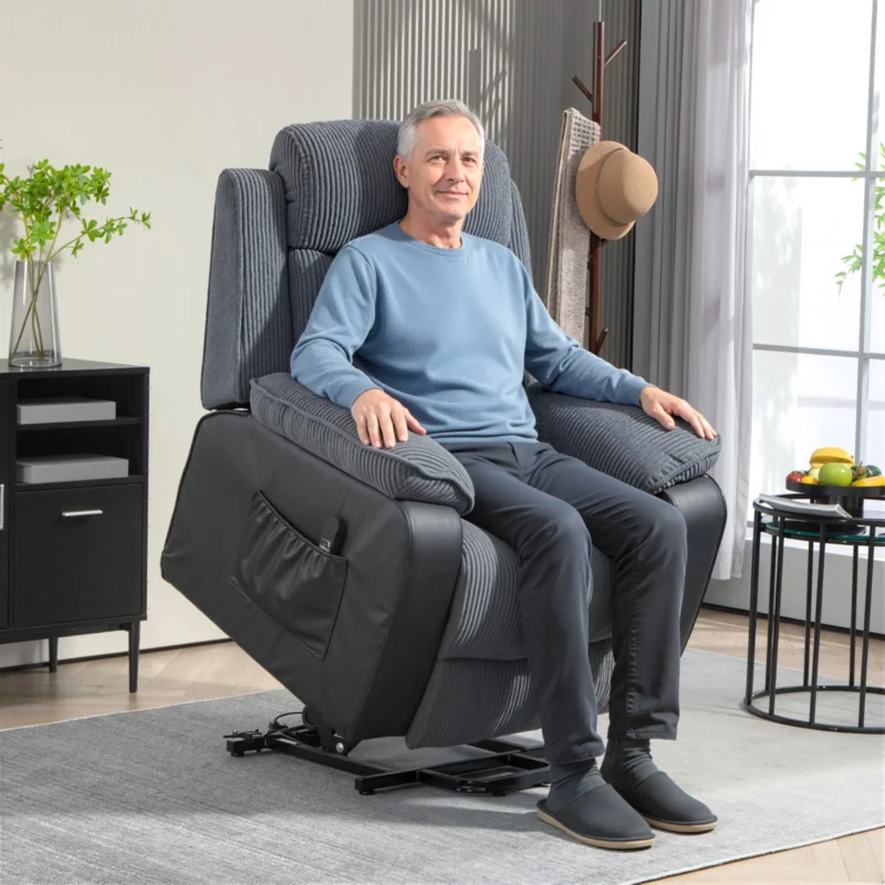 Man sitting on a dark grey power lift recliner chair
