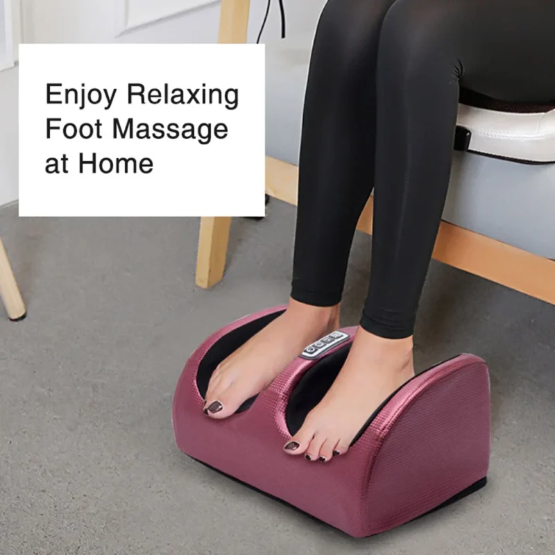 Woman using the Bio-Lec Mobility electric foot massager at home while seated, both feet inside the massager