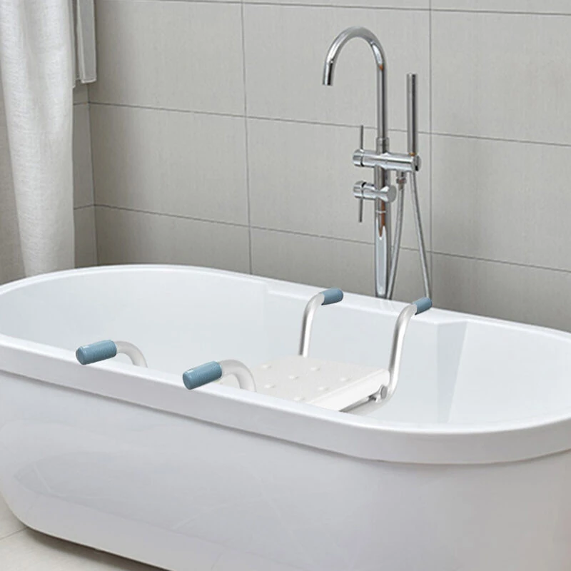 Suspended bath seat fitted across a freestanding bathtub in a tiled bathroom