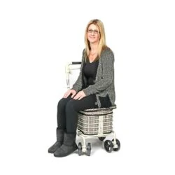 Woman sitting on the Walk and Rest Prestige seated shopping trolley