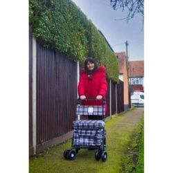 Woman walking outdoors with the Walk and Rest Sovereign shopping trolley
