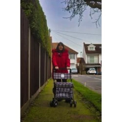 Woman pushing the Sovereign shopping trolley along a path